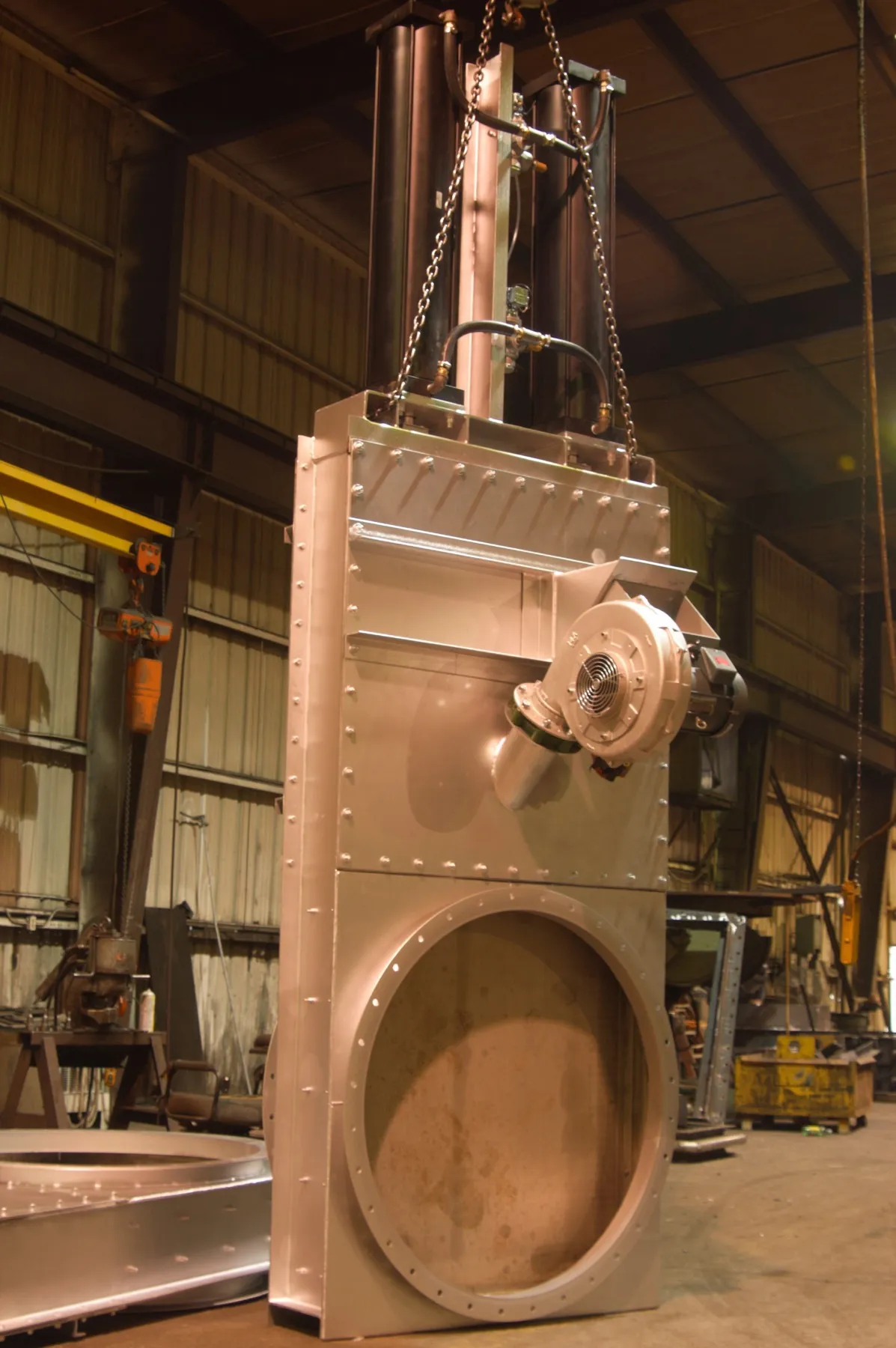 Tall stainless slide-gate isolation damper fabricated in the Barron Fan shop